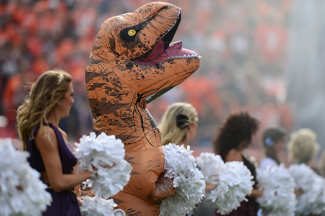 Broncos cheerleader wins Halloween with T-Rex outfit