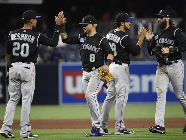Rockies hit 3 home runs to beat winless Padres 7-4
