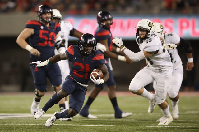 Tate's 5 TD passes lead Arizona to 42-34 win over Colorado